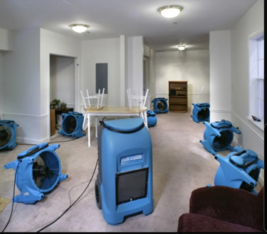 Air movers and dehumidifier setup for Water Damage Restoration in Delphos